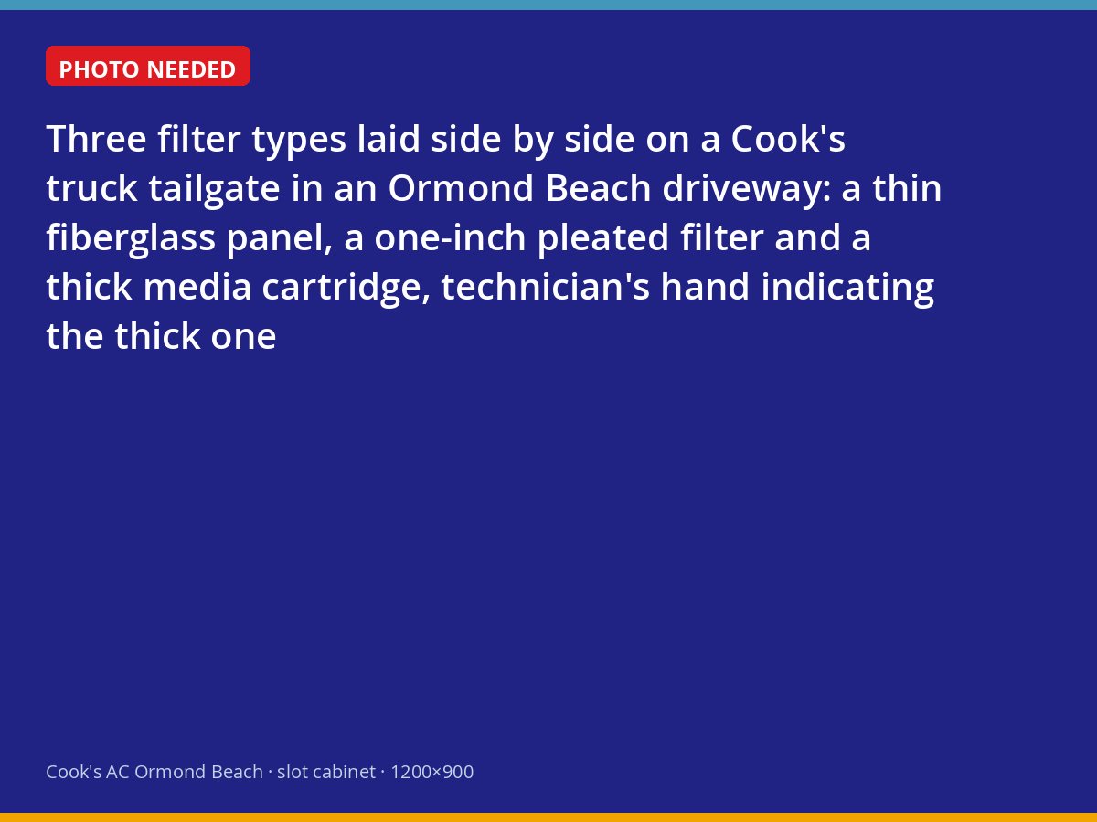 Three air filter types compared on a truck tailgate, from thin fiberglass to thick media cartridge