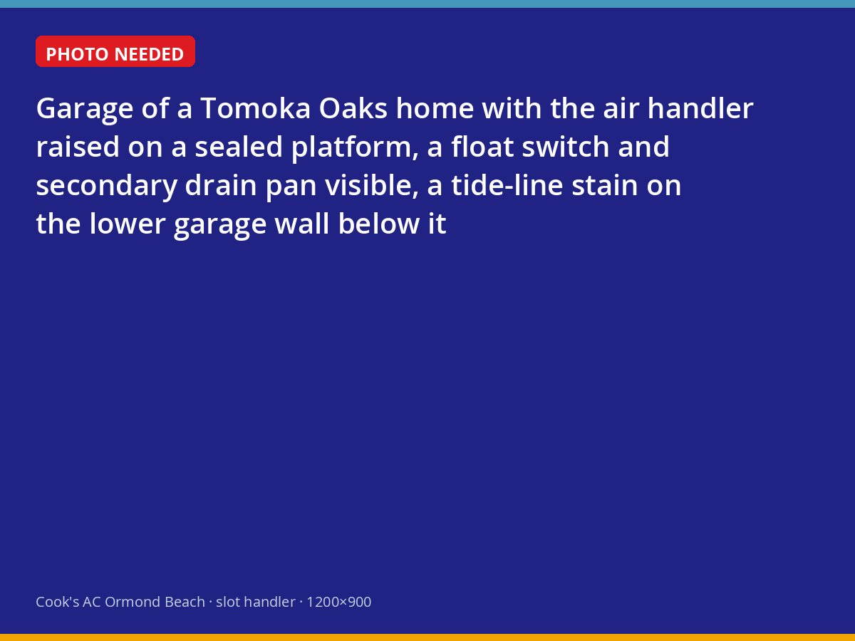 Air handler raised on a platform above a flood stain in a Tomoka Oaks garage