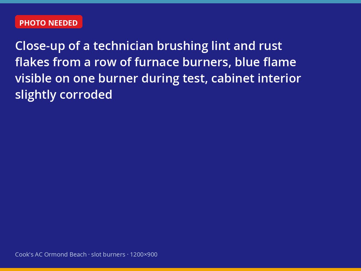Technician cleaning furnace burners before a test firing